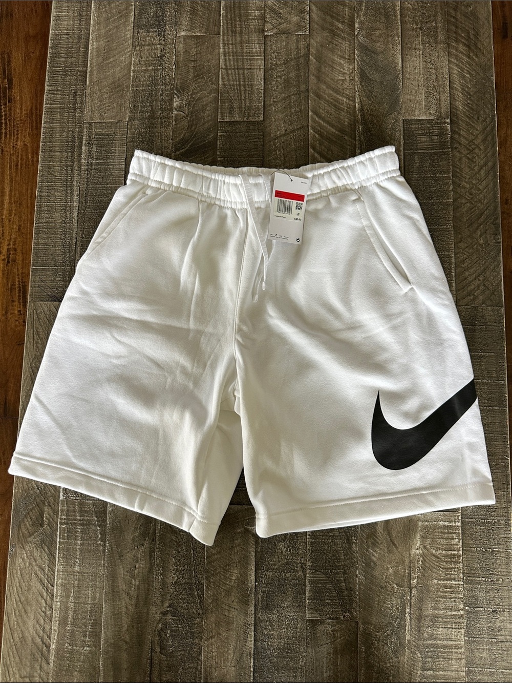 Nike Men's White Athletic Shorts with Black Swoosh